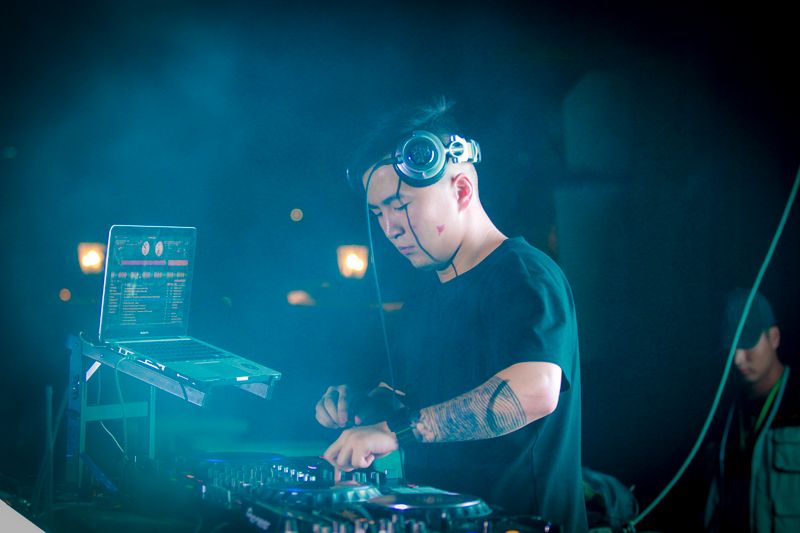 DJ mixing during an energetic club performance
