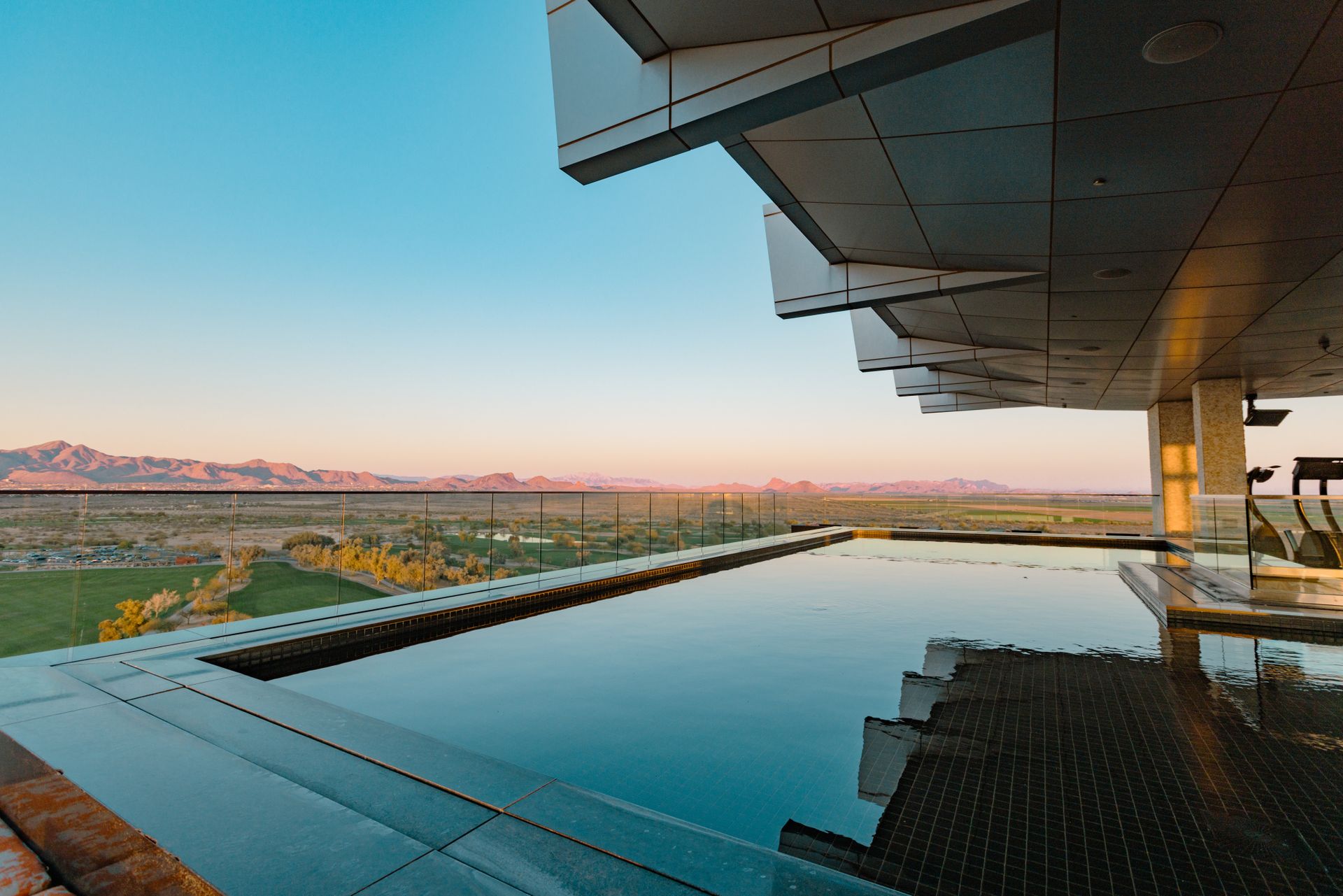 Infinity pool overlooking Arizona mountains at a modern Scottsdale hotel.