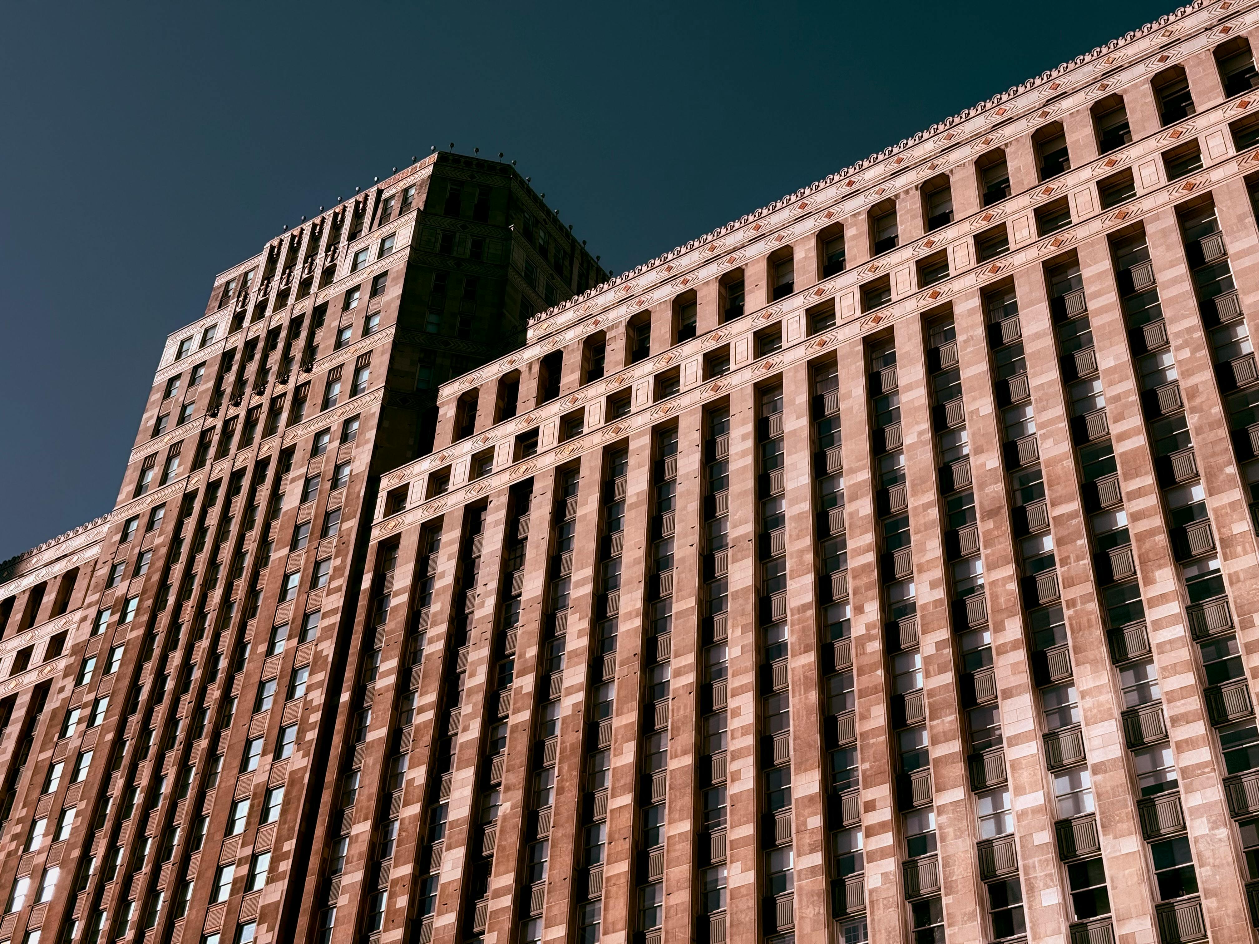 Capture of a historic skyscraper in Chicago's cityscape on a sunny day.