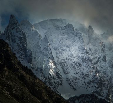 Stunning view of snow-covered mountains under a dramatic sky in Rize, Türkiye.