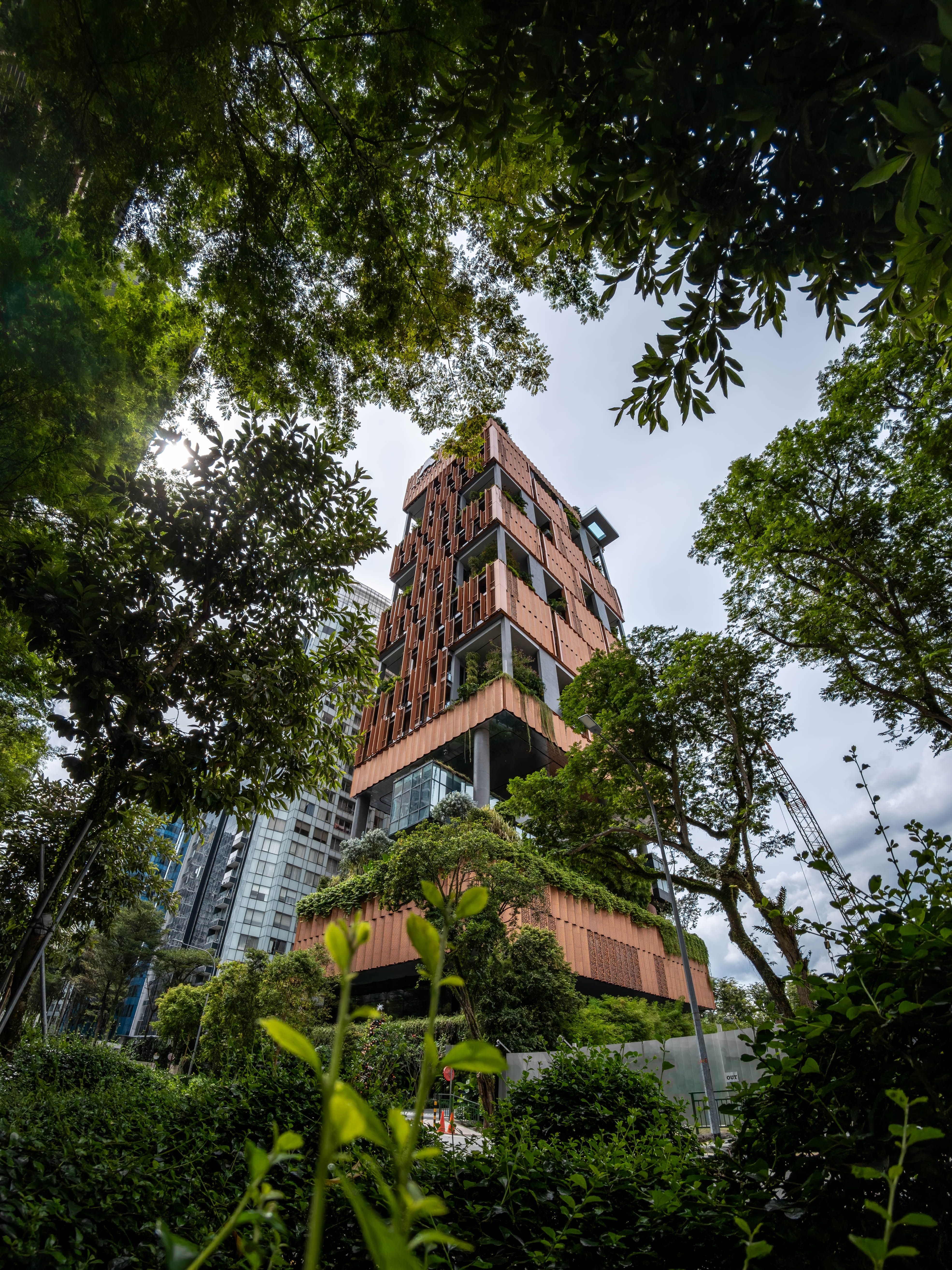 Illustrative photograph: modern sustainable urban building with greenery