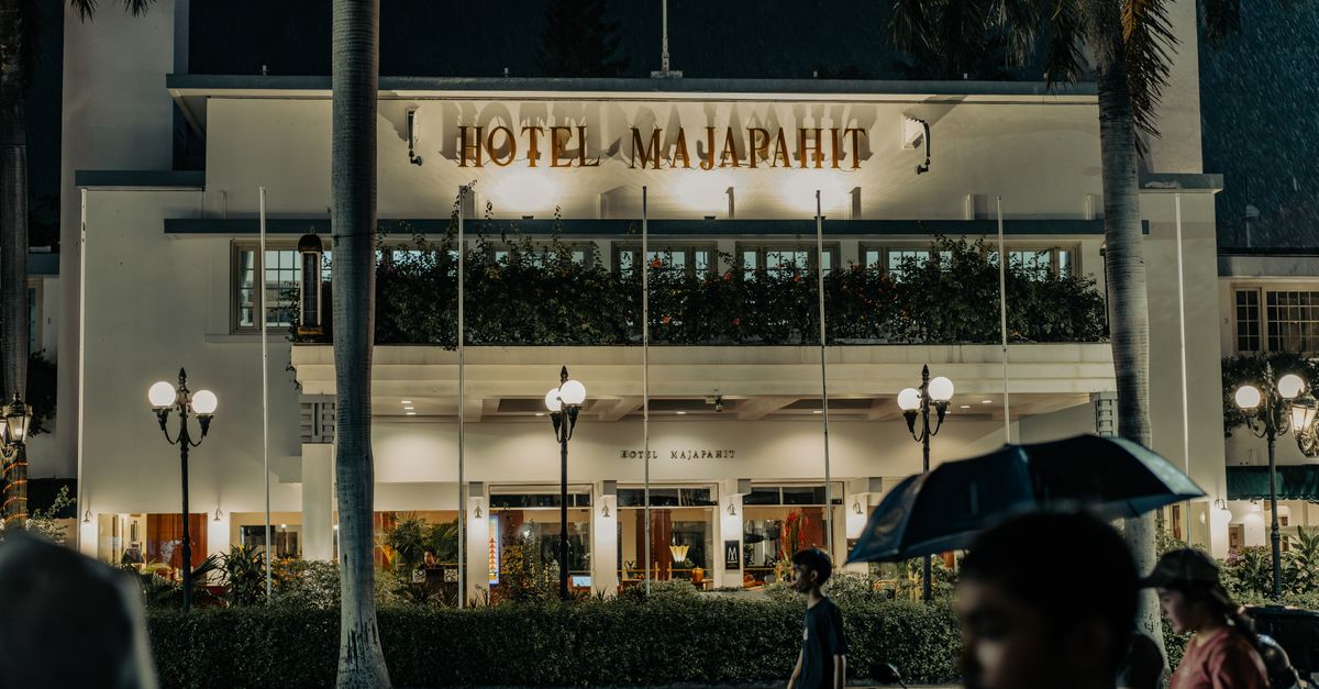 Stunning evening shot of Hotel Majapahit, a colonial landmark in Surabaya, Indonesia.