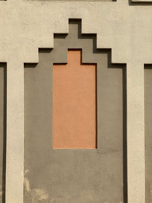 Free Abstract geometric design on a textured wall, highlighting modern architecture. Stock Photo