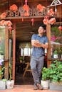 Man Relaxing at Rustic Café Entrance in Da Lat
