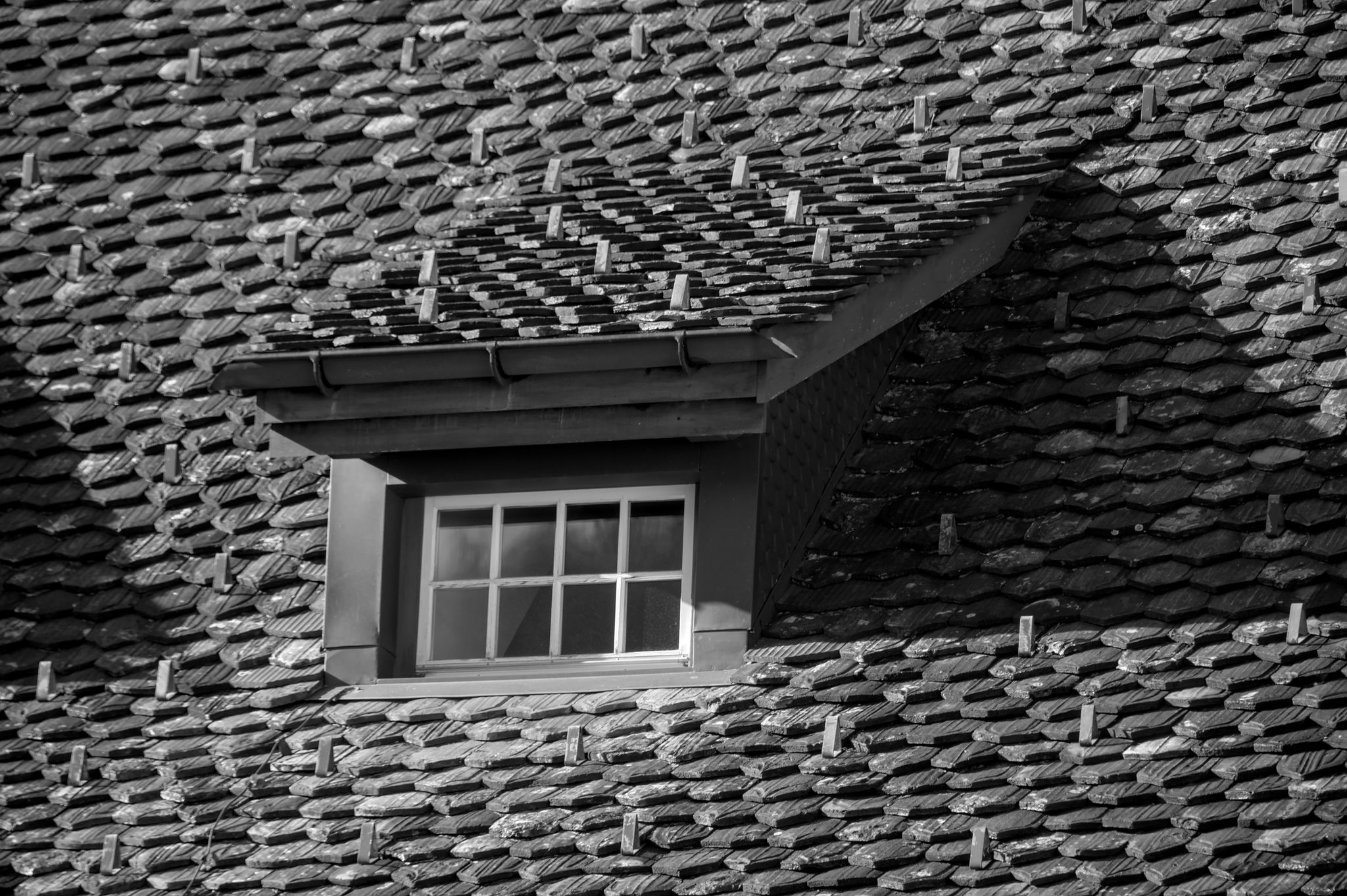 Roofer working on a house roof