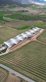 Aerial view of a modern winery with unique architecture in La Rioja, Spain.