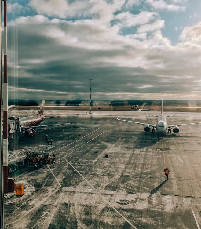 Free Man Standing on Airport Apron Stock Photo