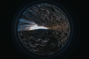 Abstract view through a rough textured tunnel — photo by Onur Kaya on Pexels