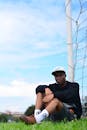 Young Man Relaxing by Soccer Goal Outdoors
