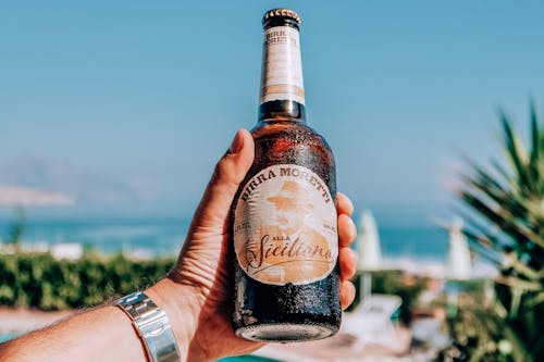 Free Man with alcoholic beer on resort Stock Photo