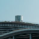 Modern Rooftop with Circular Vent and Glass Railings