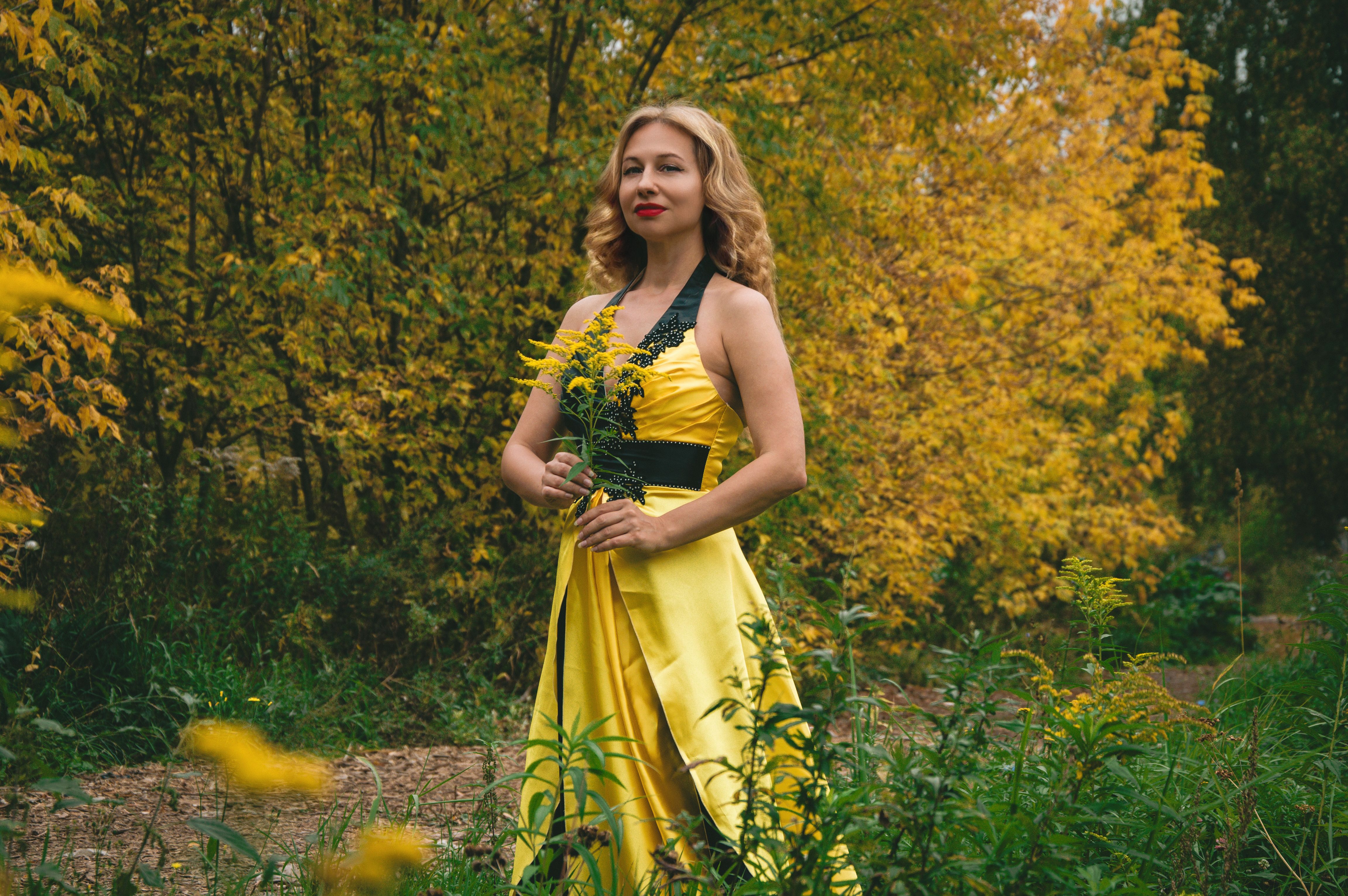 Woman in Yellow Dress Amidst Autumn Foliage · Free Stock Photo