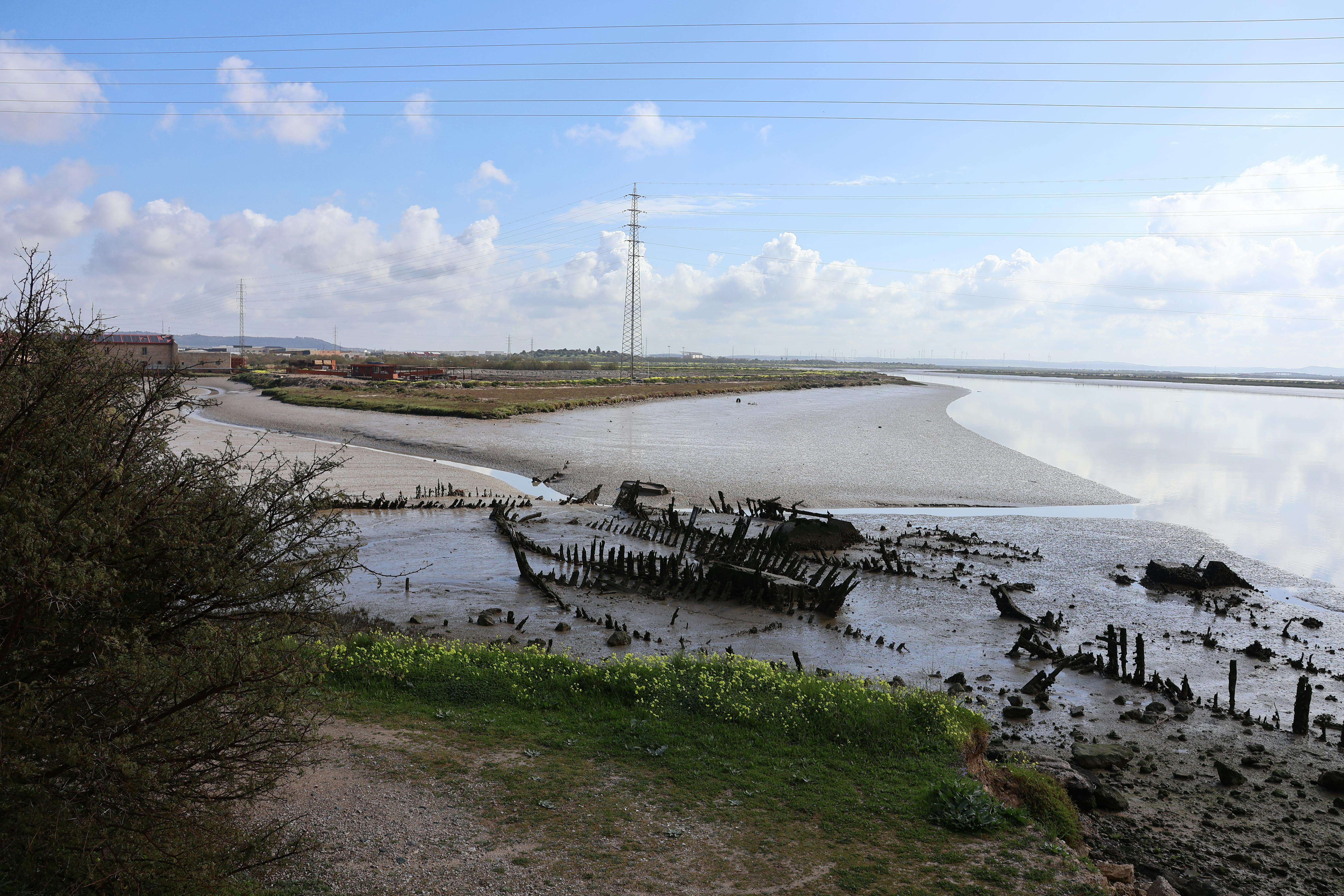 Scenic view of an old ship's remains by the riverbank in El Puerto de Santa María, Spain.