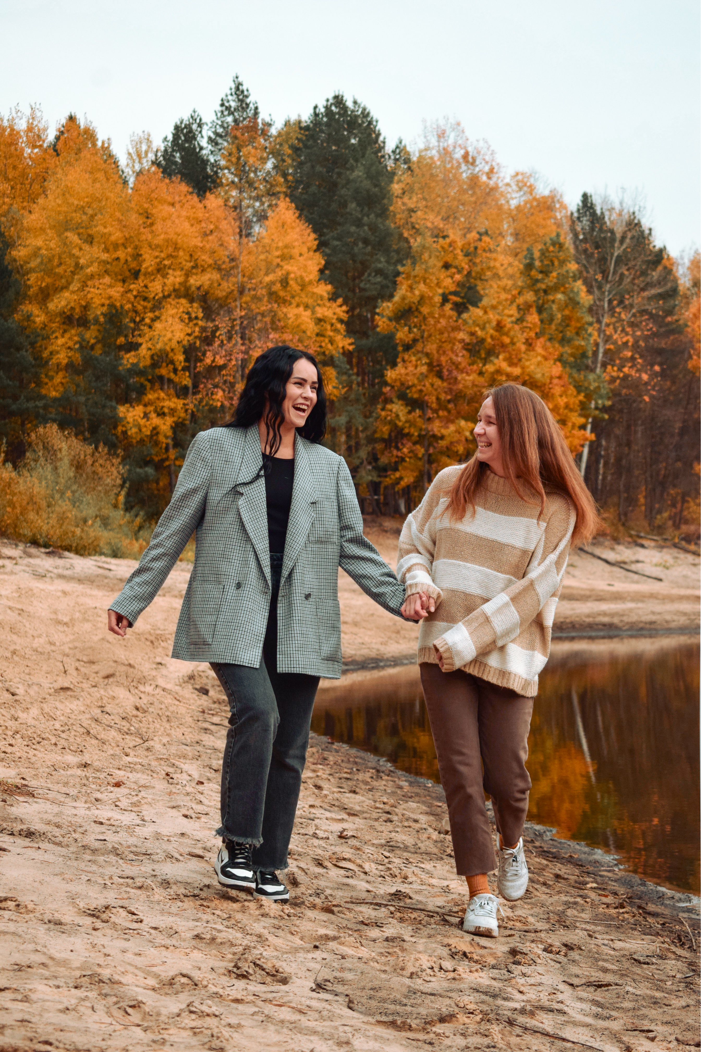 Happy Friends Walking by Autumn Lake · Free Stock Photo