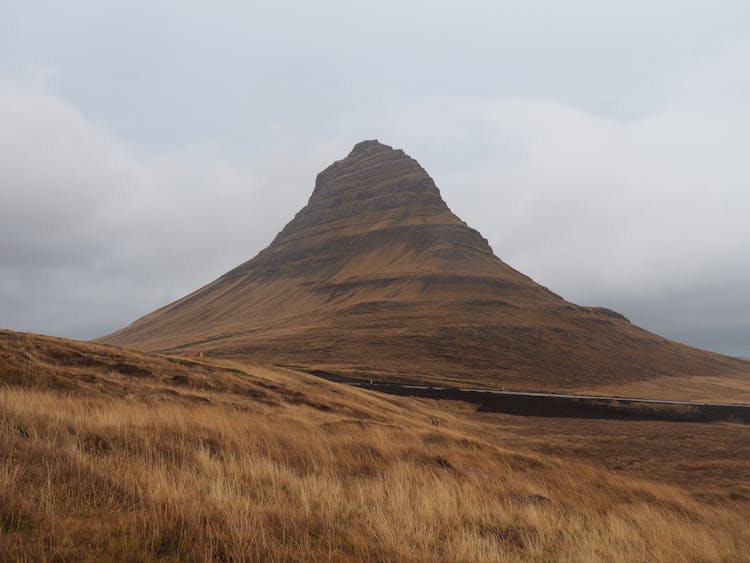 Brown Mountain Under White Sky