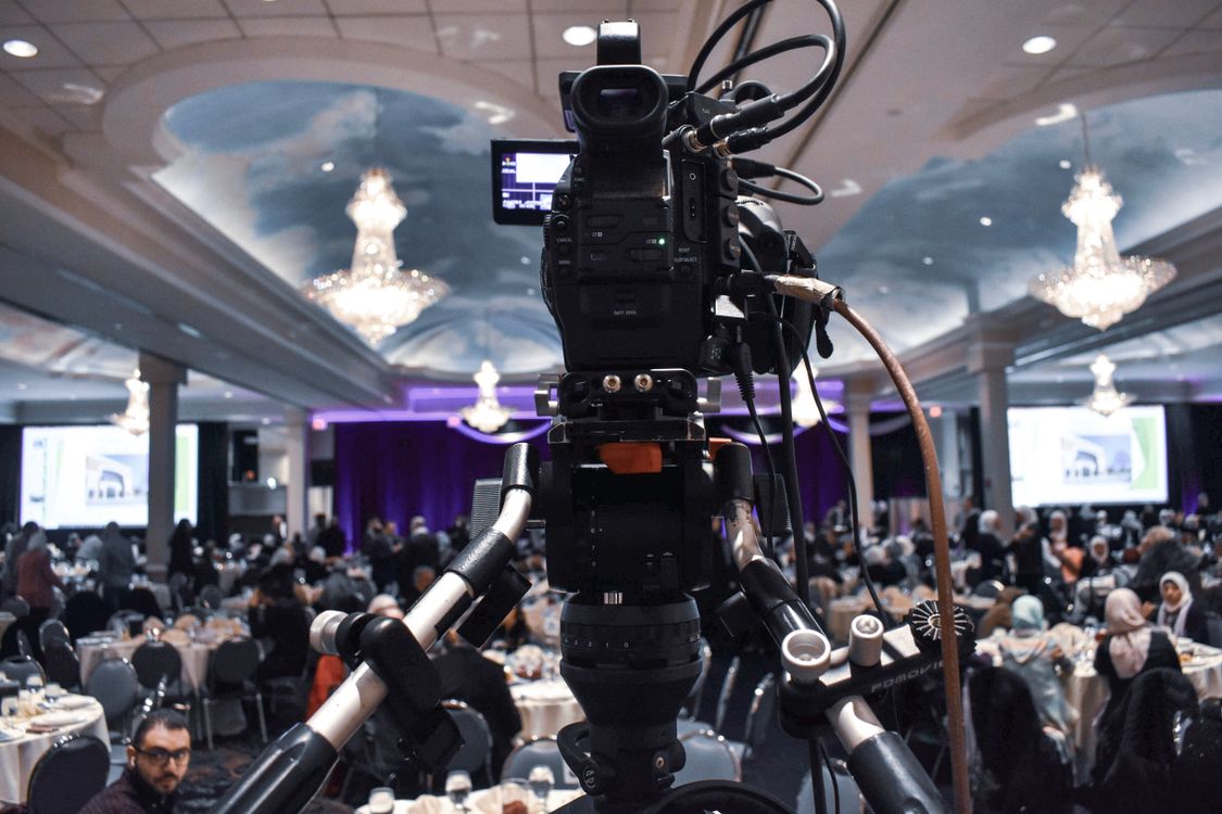 Professional video camera recording event in ballroom · Free Stock Photo