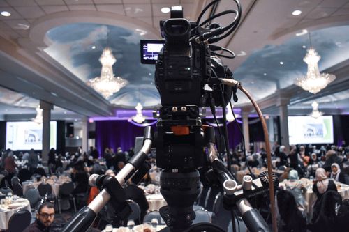 A presenter speaking to camera — photo by Eduardo Romero on Pexels