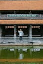 Person Posing at Historic Landmark in Vietnam
