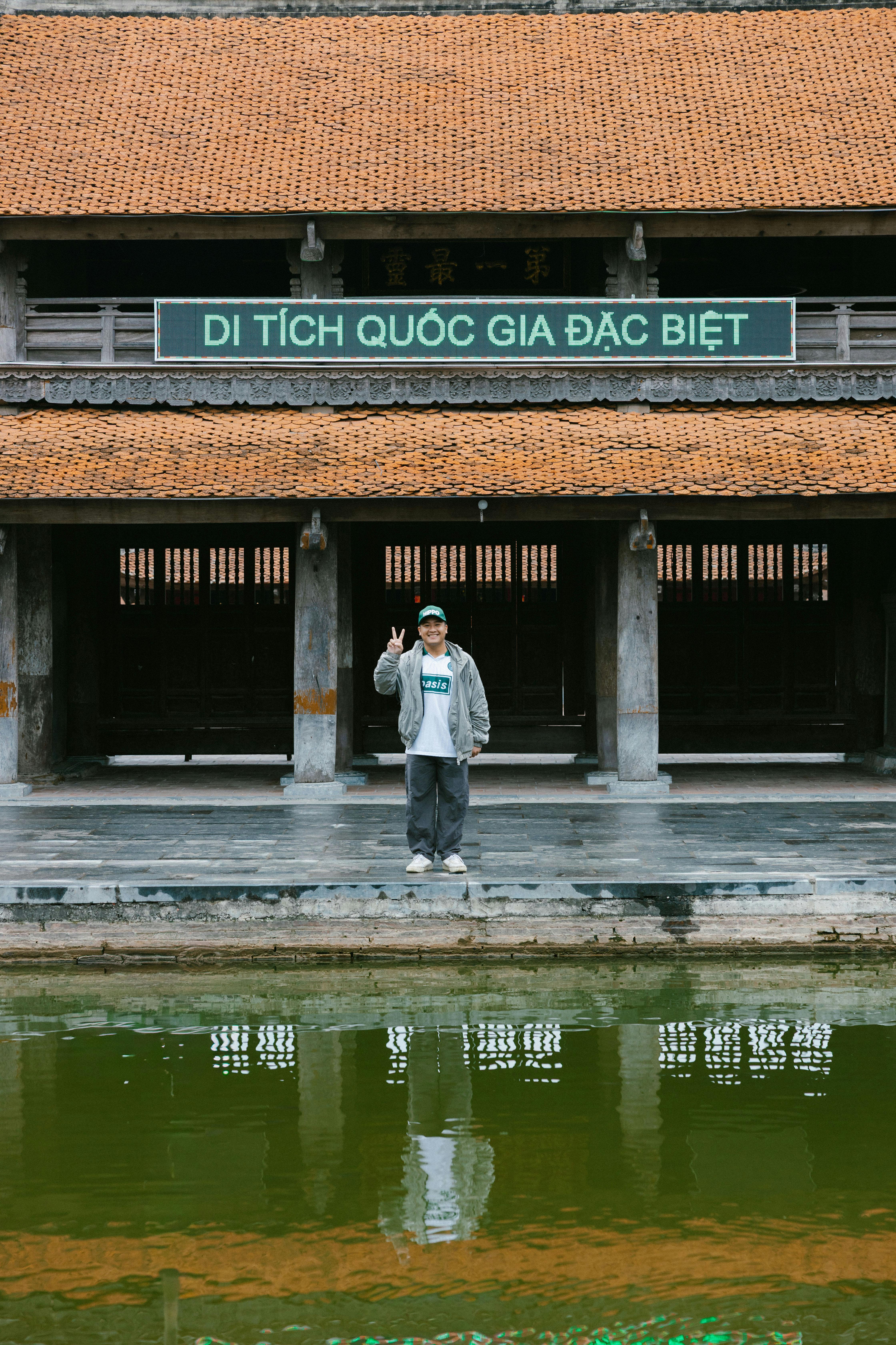Person Posing at Historic Landmark in Vietnam