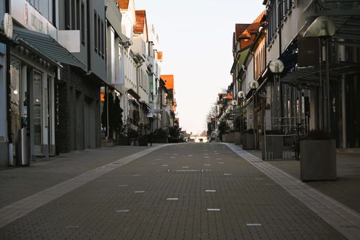 Peaceful empty street lined with buildings in Baden-Württemberg, Germany, capturing the essence of early spring.