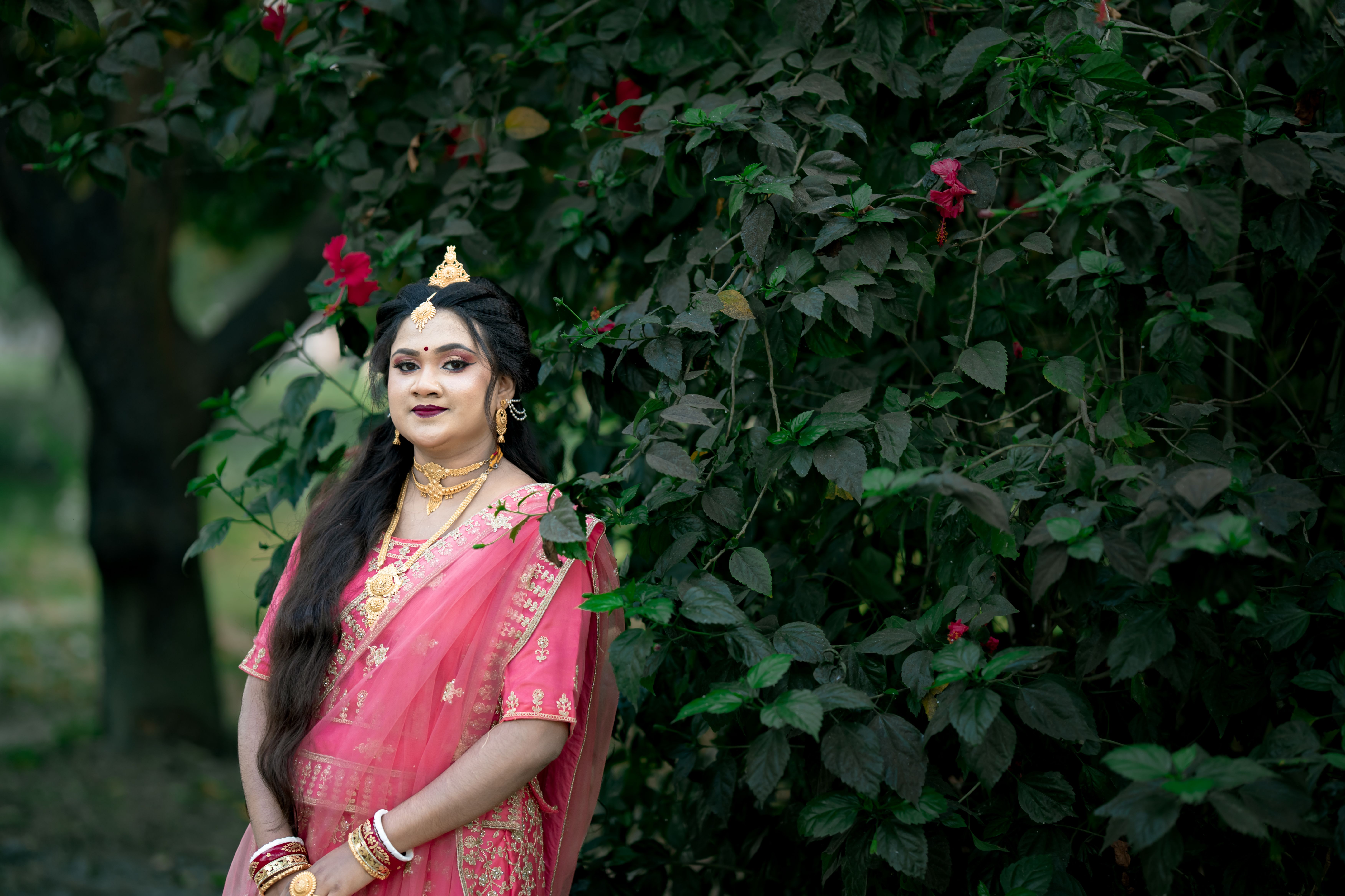 Traditional Indian woman in pink saree outdoors · Free Stock Photo