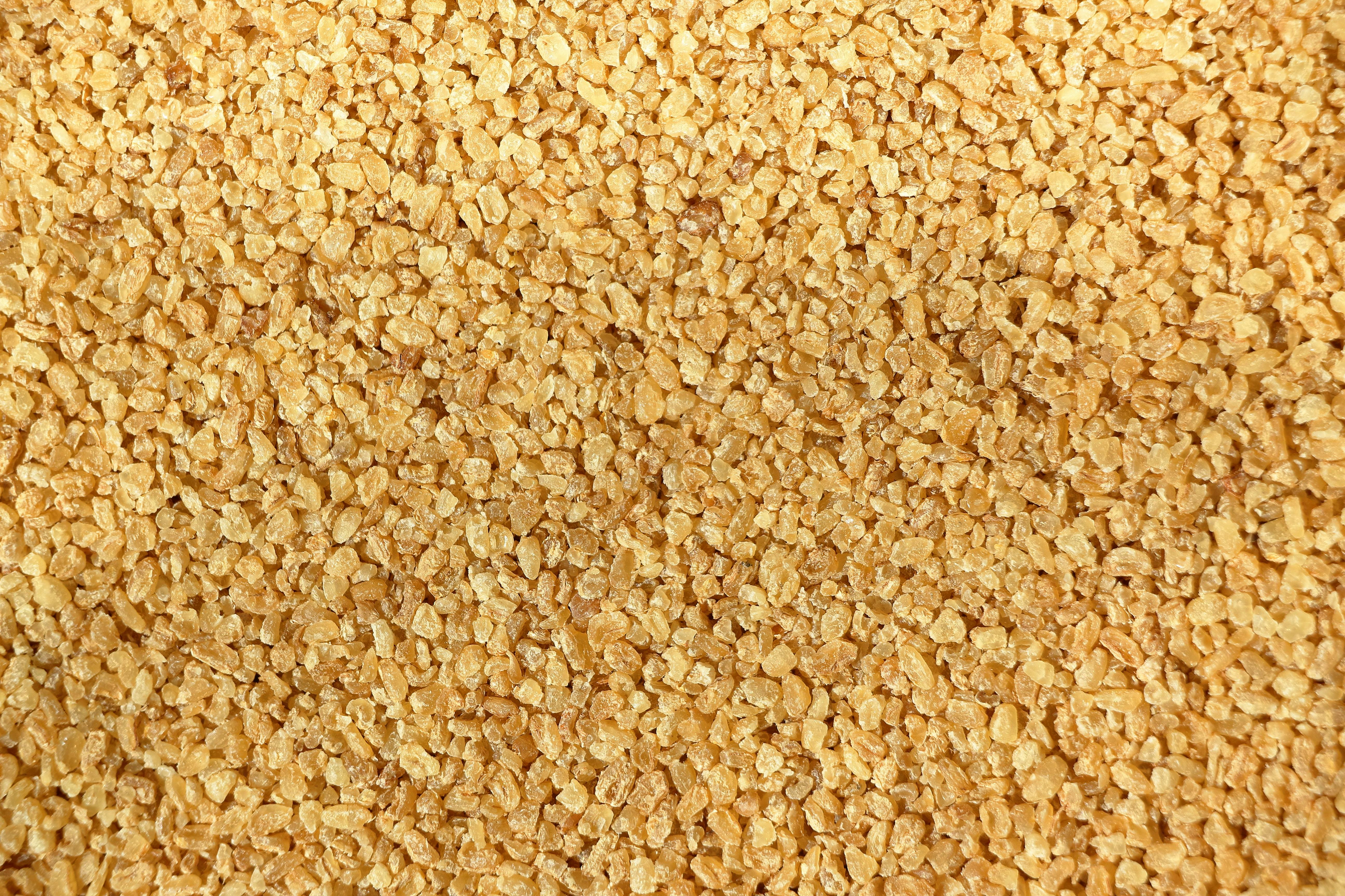 De franc Imatge detallada que mostra la textura dels grans de blat bulgur crus. Foto d'estoc