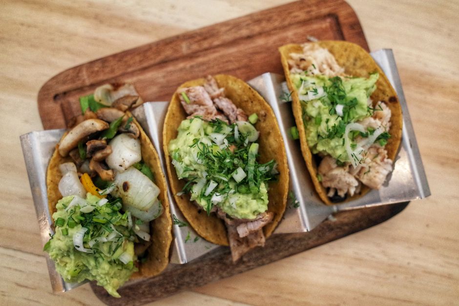 Freshly cooked pork carnitas with salsas and warm corn tortillas Freshly cooked pork carnitas with salsas and warm corn tortillas