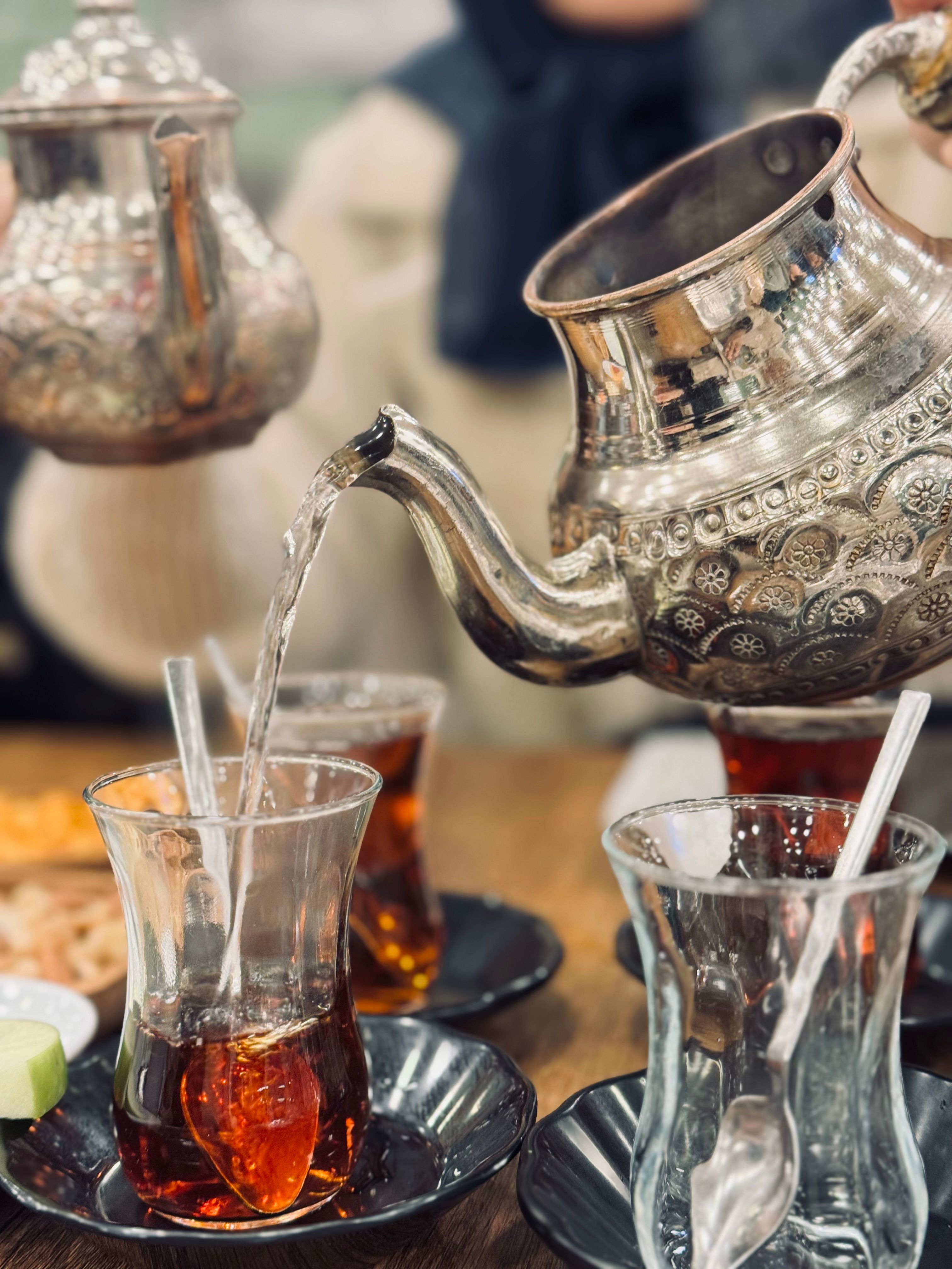 Traditional Turkish Tea Being Poured at Café · Free Stock Photo