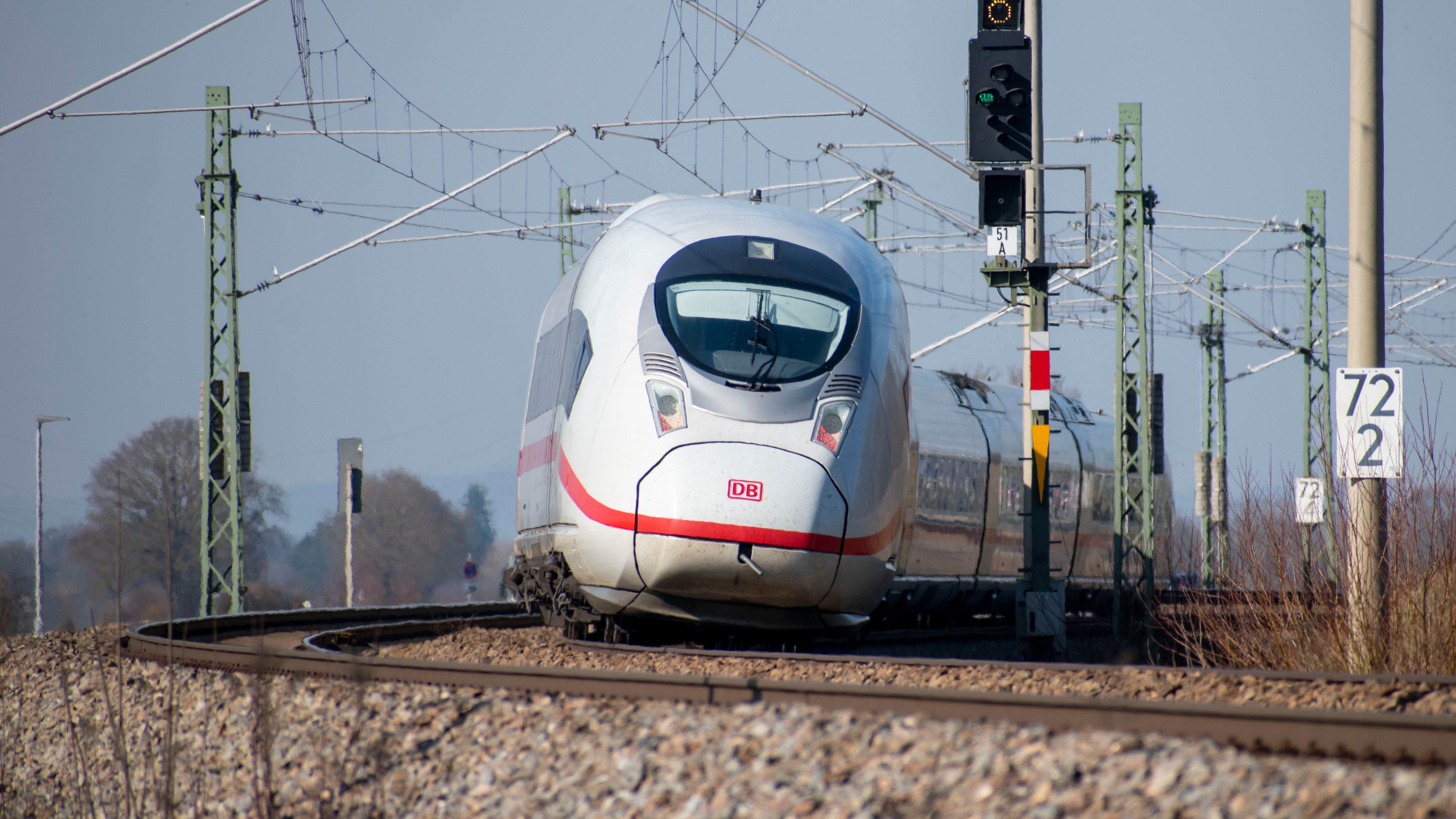 High-speed ICE train on curved railway · Free Stock Photo