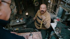 Artisan crafting in traditional workshop setting