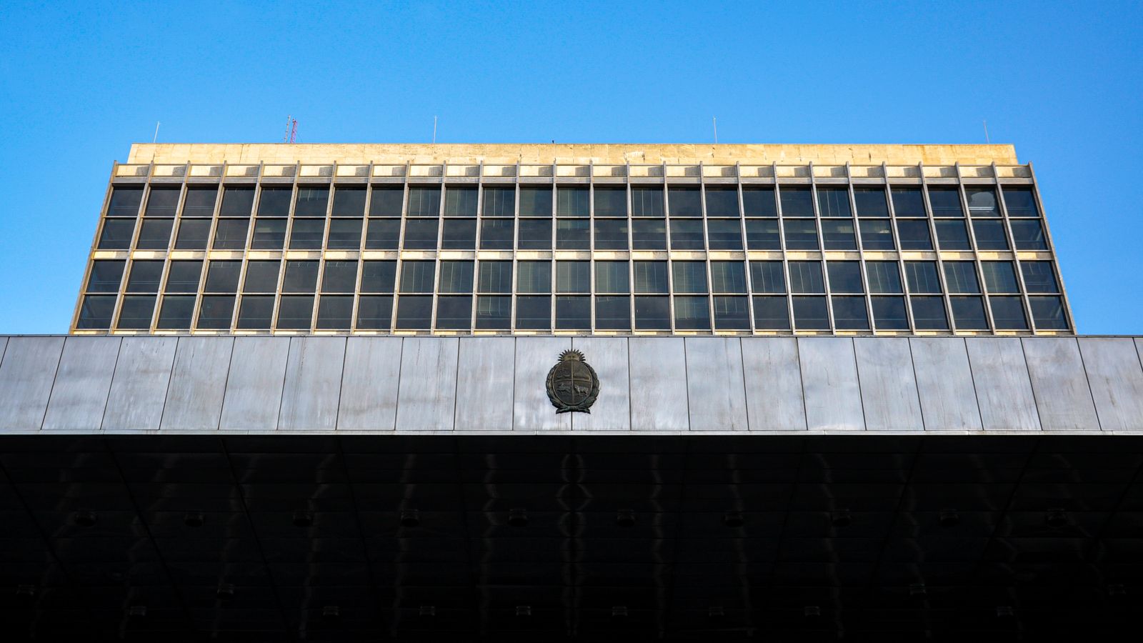 Urban architecture of a government building with a clear blue sky in Montevideo, Uruguay.