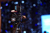 Professional Video Camera Setup with Bokeh Lights