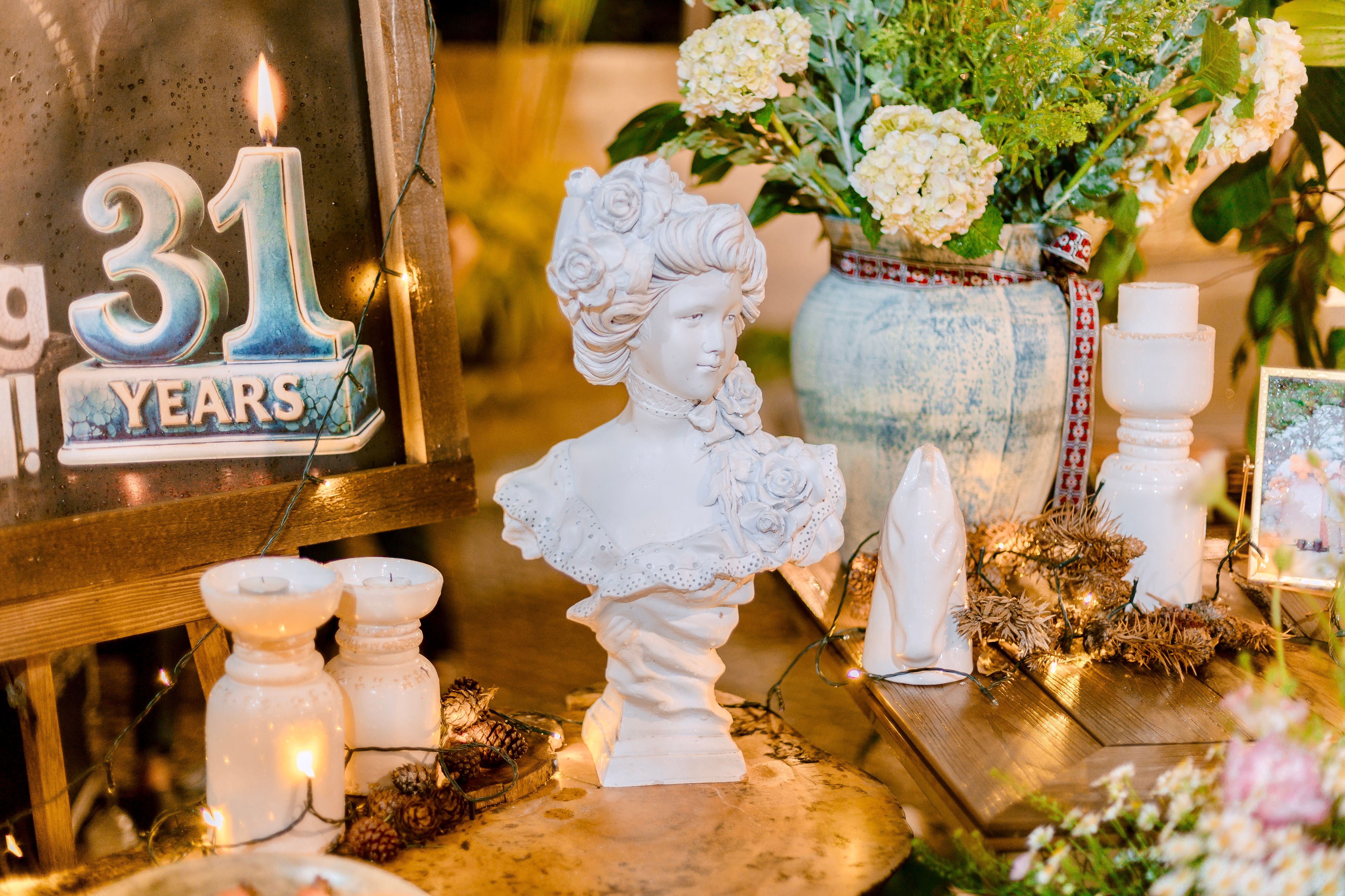 Elegant table setting with flowers and decor for a 31st anniversary celebration.