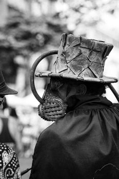 A person in an intricately designed top hat and gas mask, creating a dramatic effect.