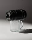 Creative Still Life with Camera Lens and Glass Mug