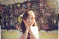 Cheerful Schoolgirl Posing in Classroom