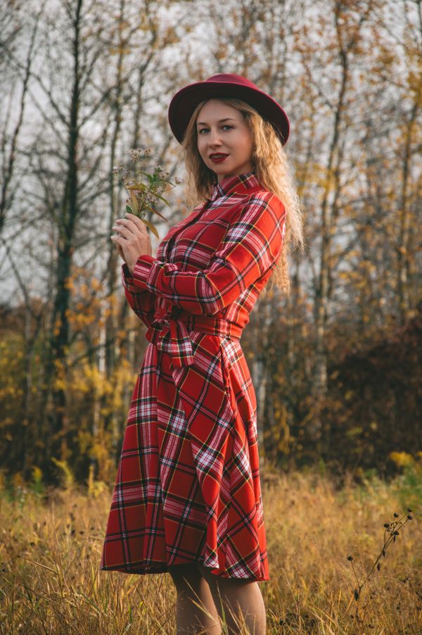Woman in a plaid shirt dress with a soft belt