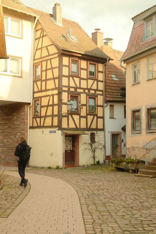 Free Picturesque half-timbered houses line a cobblestone street in Lore am Main, Germany. Stock Photo