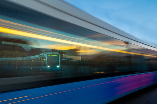 Dynamic shot of a fast-moving tram in Gothenburg during twilight.