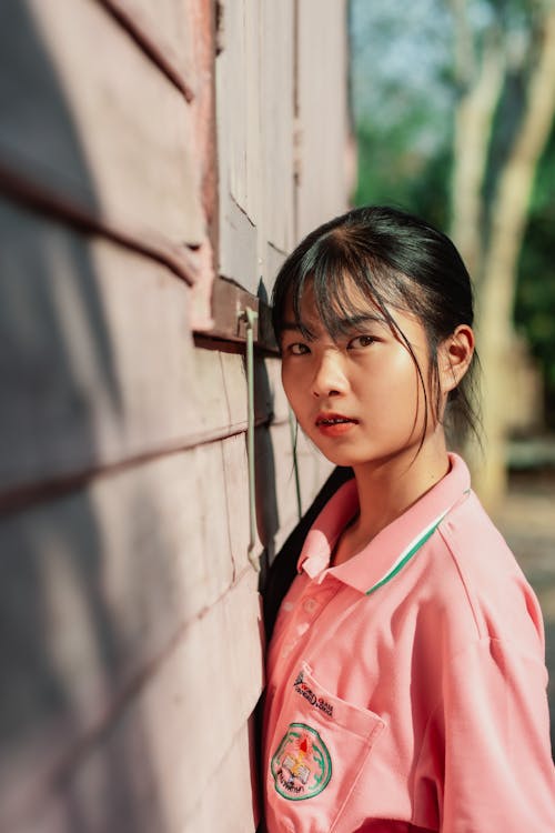 Girl Wearing Pink Polo Shirt