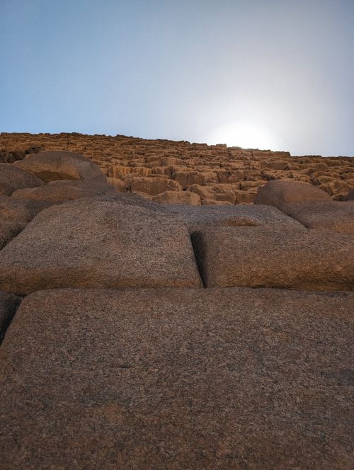 Free Close-up of the ancient stone blocks of the Great Pyramid of Giza under the sun. Stock Photo