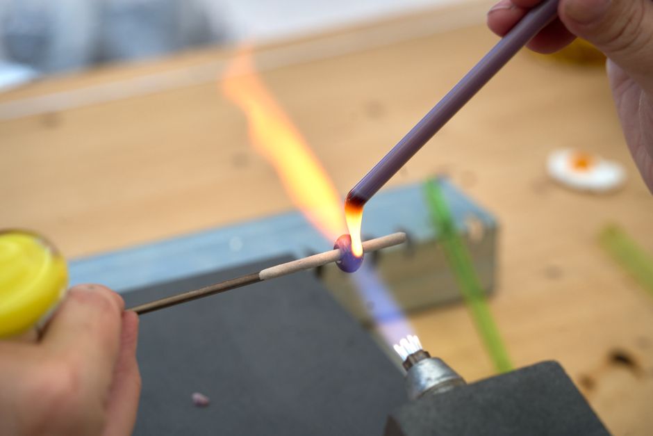 Close-up of glass bead making with an open flame in Tudela de Duero, Spain.