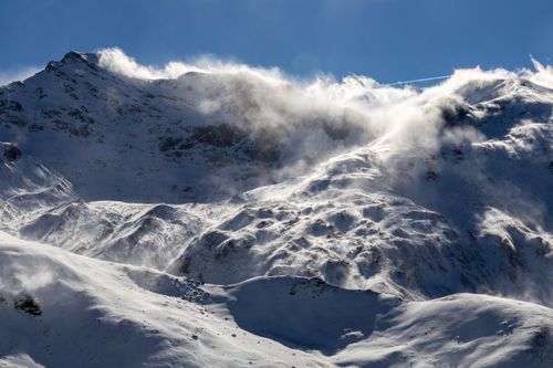 Free Breathtaking view of snow-covered mountain peaks in Salzburg under a clear blue sky. Stock Photo