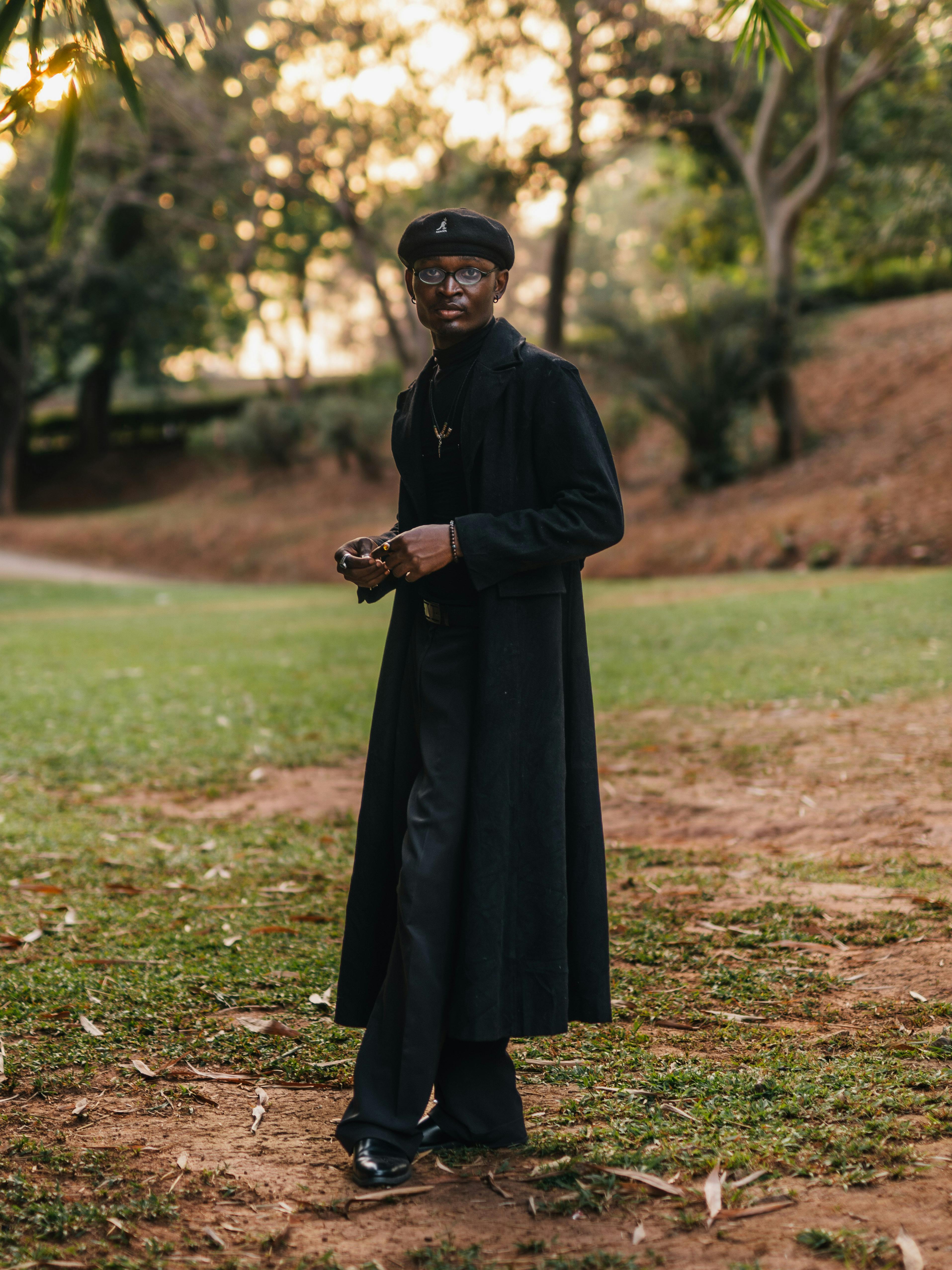 Stylish Person in Black Walking in Abuja Park