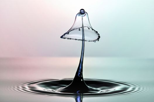 A mesmerizing macro shot capturing the collision of water droplets, forming a unique liquid sculpture.