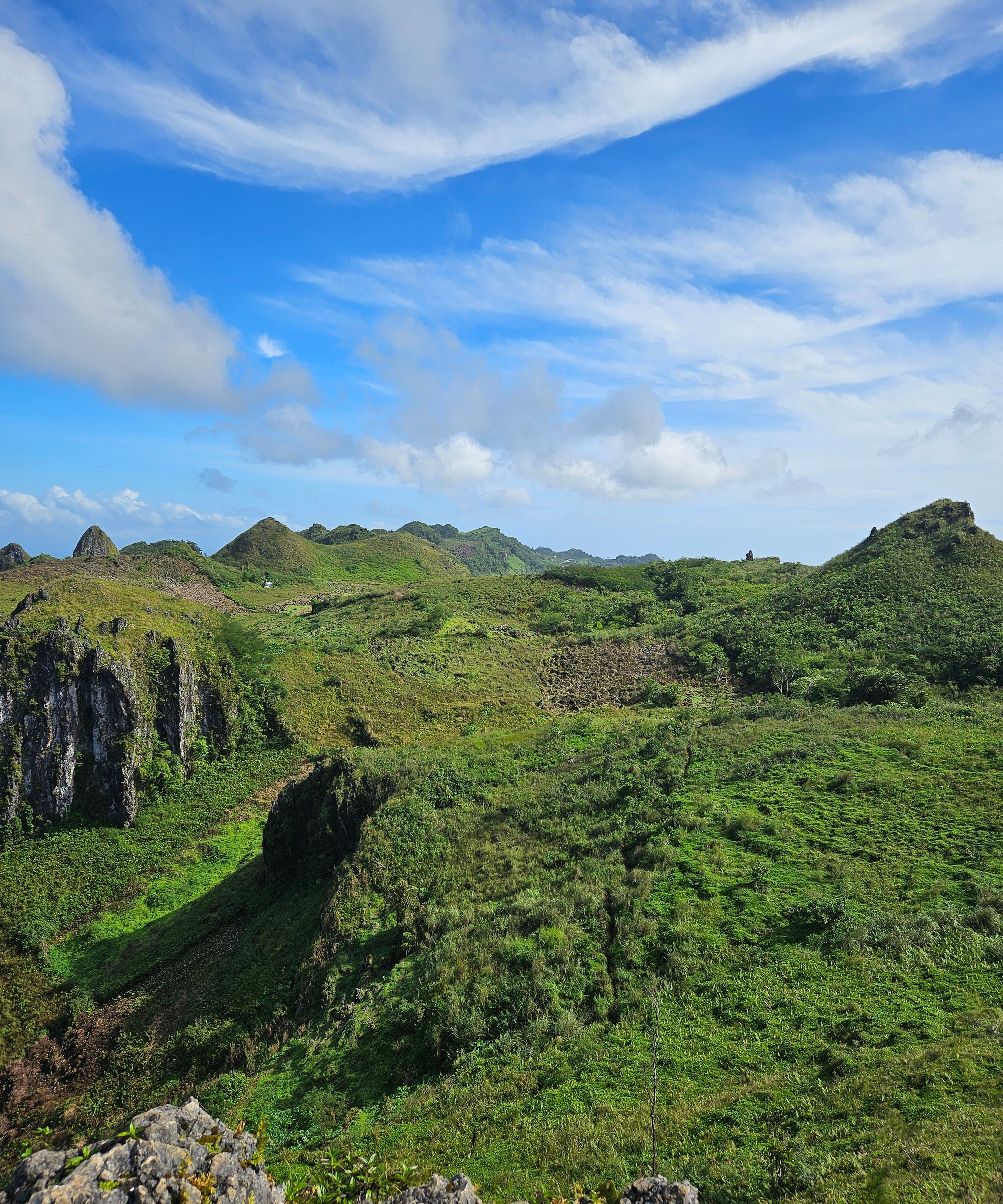 Vibrant Green Hills Under a Bright Blue Sky · Free Stock Photo