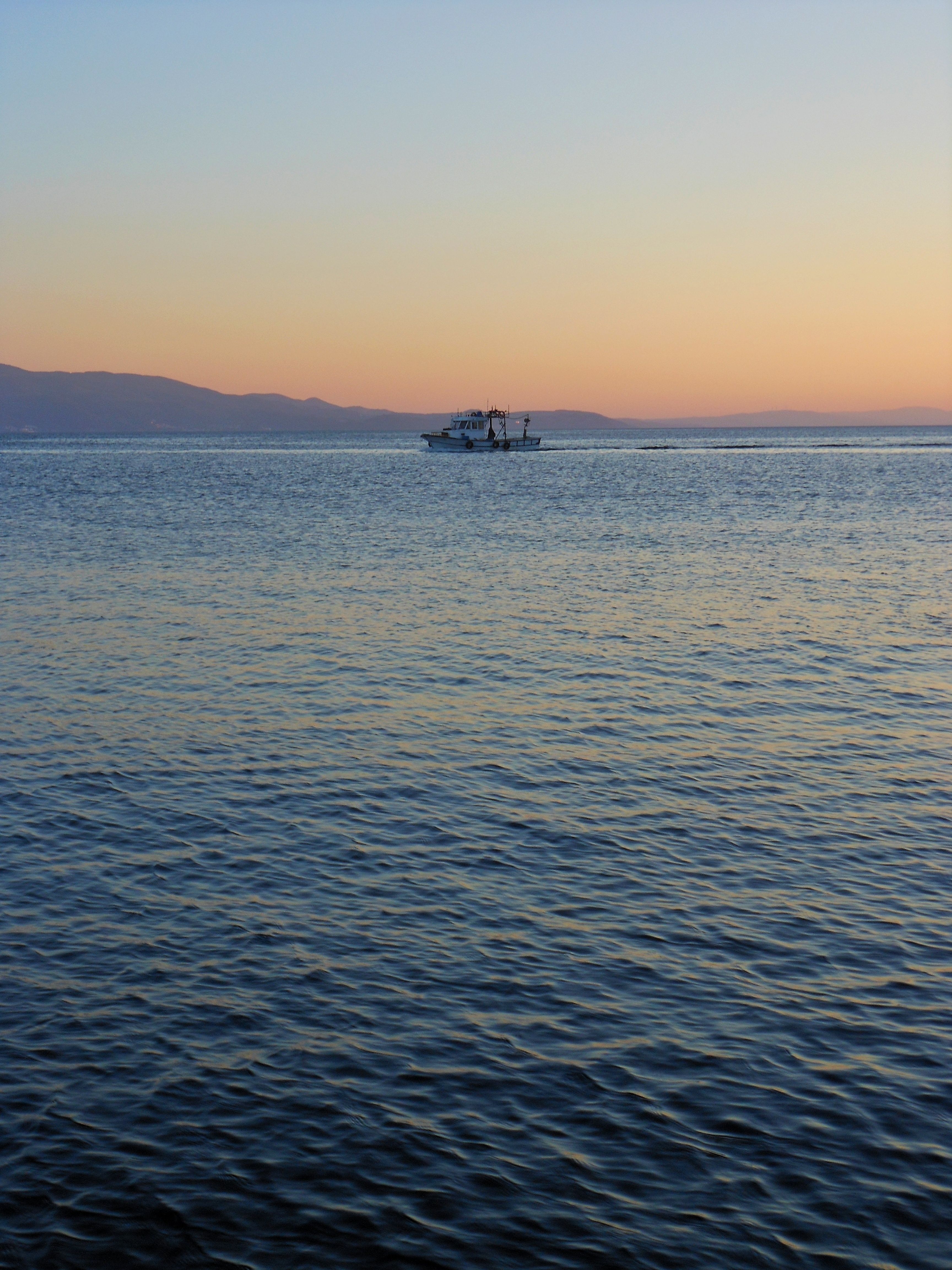 Sailboat on Body of Water during Sunset · Free Stock Photo