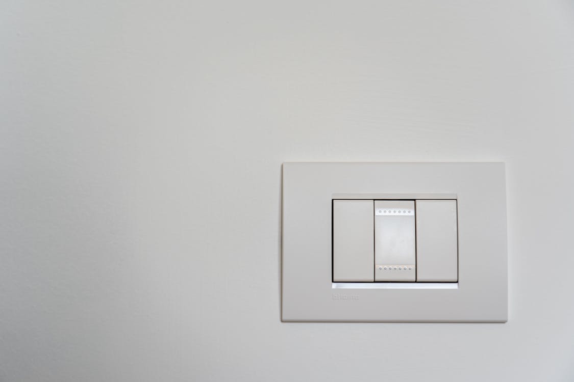 White Light Switch on White Painted Wall