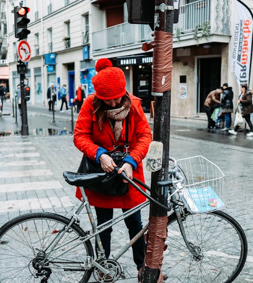 Woman On Red Coat And Red Knit Hat On Pedestrian Crossing
