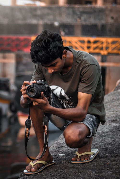 Free Photo Of Man Holding Black Camera Stock Photo